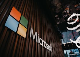 Interior view of Microsoft office with logo on wooden wall in Brussels, Belgium.